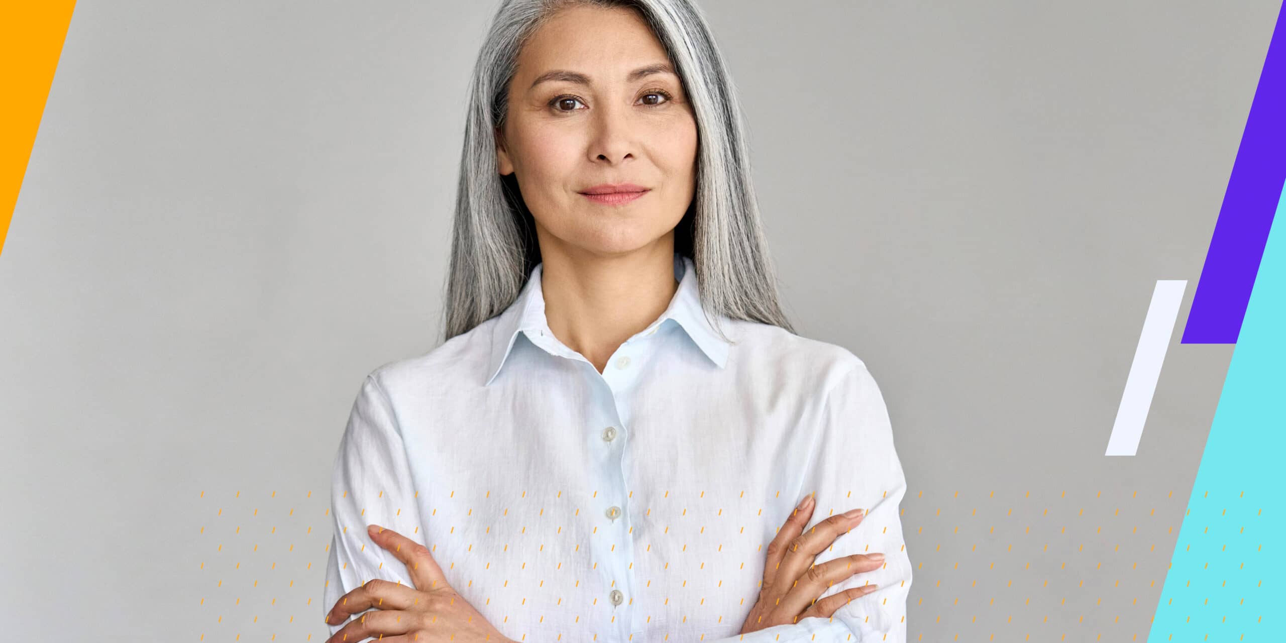 Woman looks towards camera with confident expression